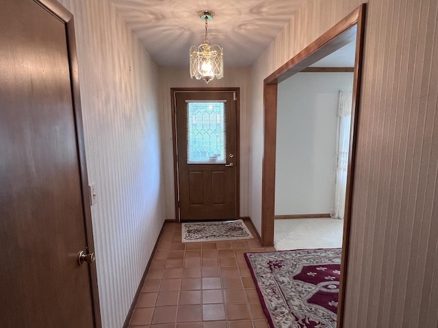 308 Tree Ln, Prophetstown, IL 61277 - entryway featuring tile patterned flooring, a chandelier, and baseboards