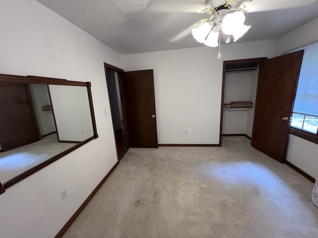 308 Tree Ln, Prophetstown, IL 61277 - unfurnished bedroom featuring light carpet, a ceiling fan, baseboards, and a closet