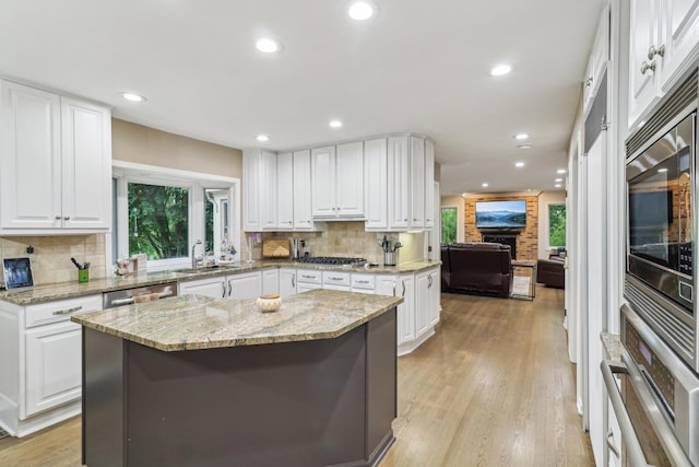 7316 Gleneagle Cir, Lakewood, IL 60014 - kitchen with a sink, decorative backsplash, stainless steel appliances, white cabinets, and recessed lighting