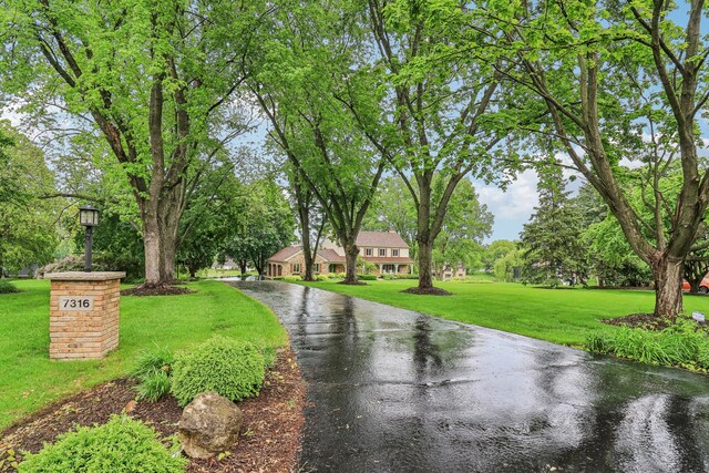 7316 Gleneagle Cir, Lakewood, IL 60014 - view of street featuring view of wooded area