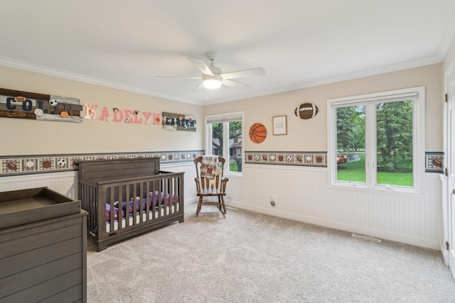 7316 Gleneagle Cir, Lakewood, IL 60014 - bedroom featuring carpet, ornamental molding, a wainscoted wall, a crib, and a ceiling fan