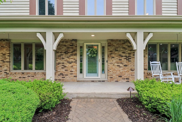 7316 Gleneagle Cir, Lakewood, IL 60014 - doorway to property featuring brick siding and a porch