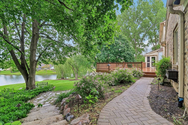 7316 Gleneagle Cir, Lakewood, IL 60014 - view of grassy yard with a deck with water view