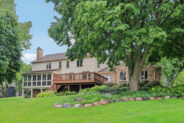 7316 Gleneagle Cir, Lakewood, IL 60014 - rear view of house featuring a wooden deck, a chimney, a yard, and stairs