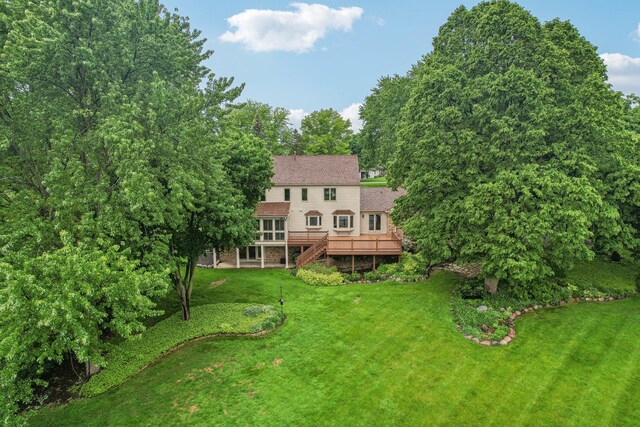 7316 Gleneagle Cir, Lakewood, IL 60014 - rear view of house with stairway, a deck, and a yard