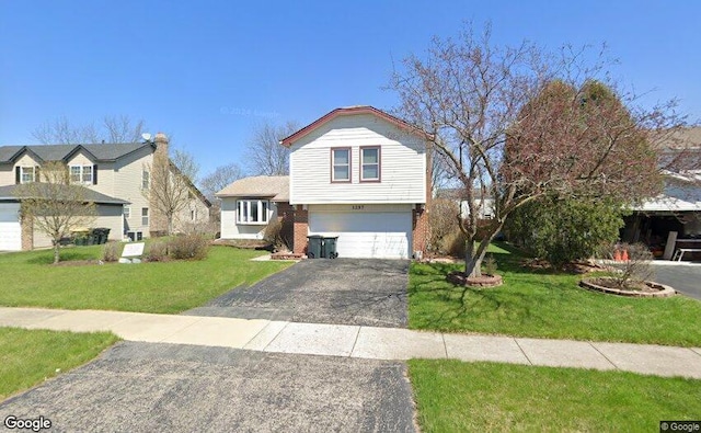 1257 Spring Valley Dr, Carol Stream, IL 60188 - view of front of property with driveway, a garage, and a front lawn