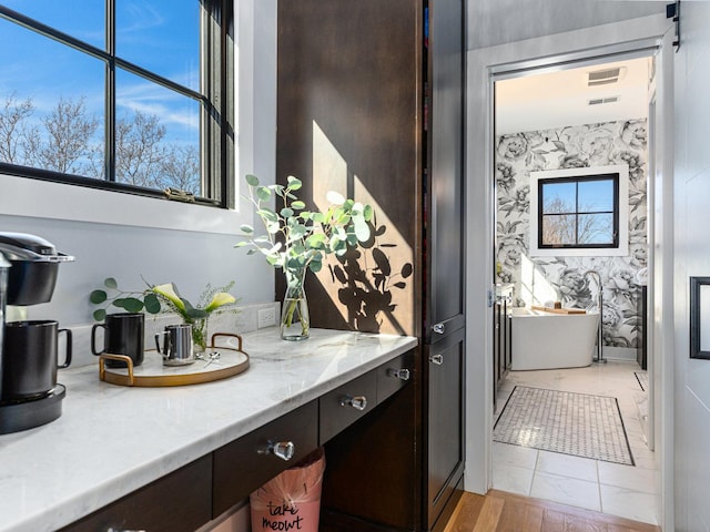 527 N Ellsworth St, Naperville, IL 60563 - full bathroom with a soaking tub, vanity, and wallpapered walls