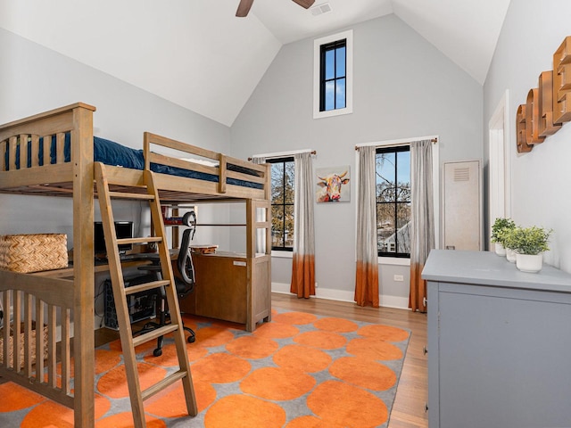 527 N Ellsworth St, Naperville, IL 60563 - bedroom featuring an office area, high vaulted ceiling, baseboards, and light wood-style flooring