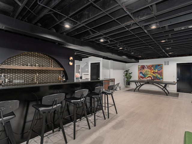 527 N Ellsworth St, Naperville, IL 60563 - indoor dry bar featuring wood finished floors