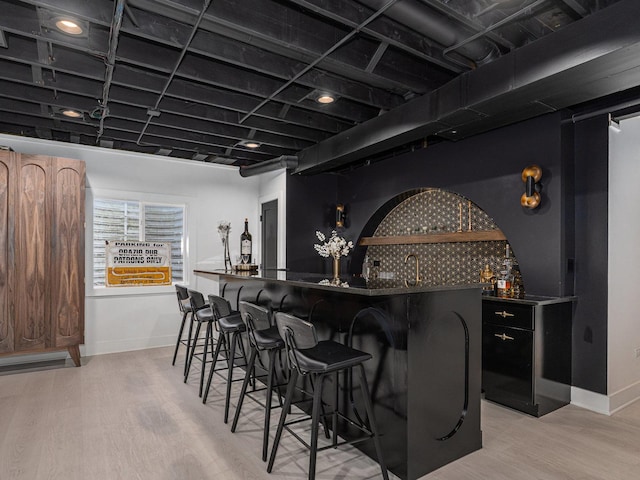 527 N Ellsworth St, Naperville, IL 60563 - indoor wet bar featuring light wood-style floors and baseboards