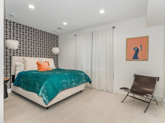 527 N Ellsworth St, Naperville, IL 60563 - bedroom featuring an accent wall, baseboards, recessed lighting, light wood-type flooring, and wallpapered walls