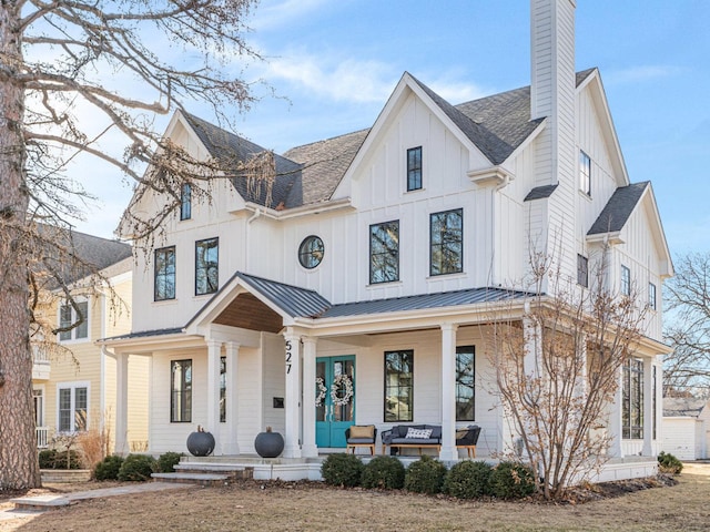 527 N Ellsworth St, Naperville, IL 60563 - modern farmhouse style home with covered porch, a chimney, board and batten siding, a shingled roof, and metal roof