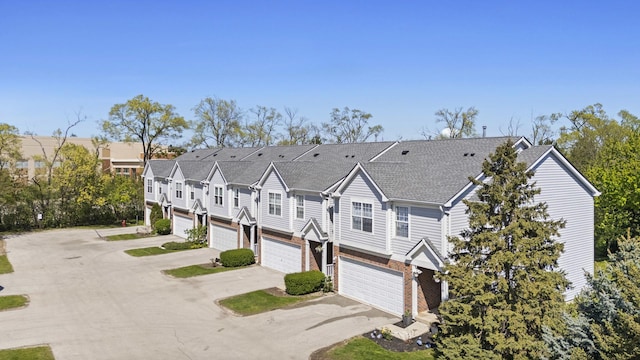 676 E Whispering Oaks Ct, Palatine, IL 60074 - townhome / multi-family property with an attached garage, brick siding, concrete driveway, and a residential view