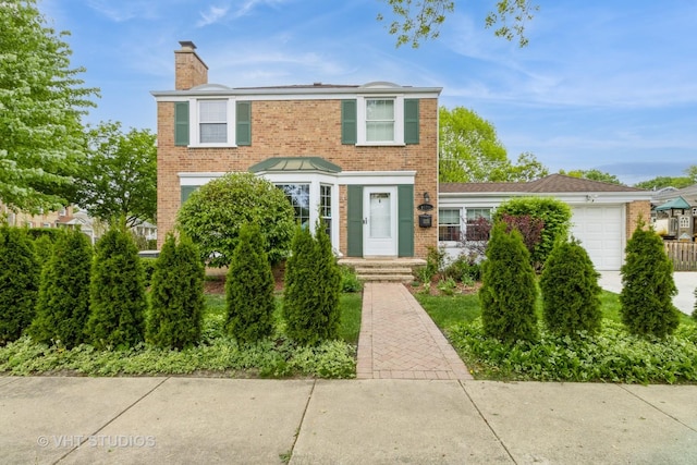 1628 W Brown St, Arlington Heights, IL 60004 - view of front of home featuring a chimney, brick siding, and an attached garage