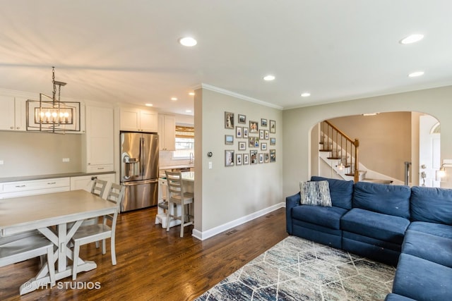 1628 W Brown St, Arlington Heights, IL 60004 - living area with arched walkways, ornamental molding, dark wood-style flooring, recessed lighting, and stairs