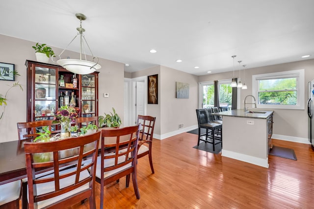 127 Saint Joseph Ave, Joliet, IL 60436 - dining space featuring light wood finished floors, baseboards, and recessed lighting