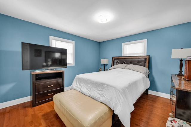127 Saint Joseph Ave, Joliet, IL 60436 - bedroom featuring multiple windows, baseboards, and wood finished floors