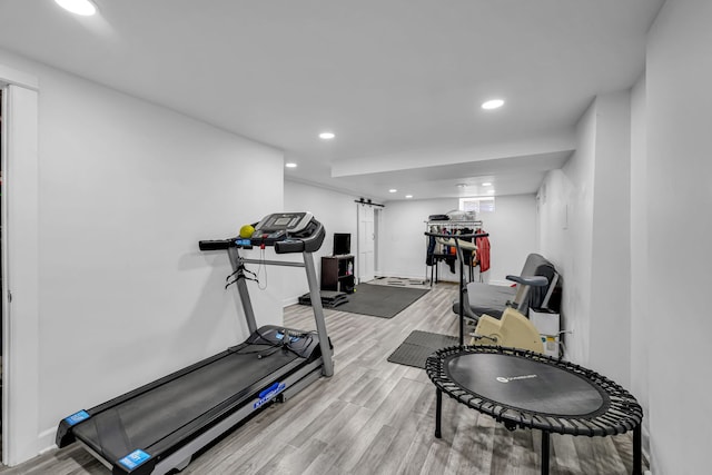 127 Saint Joseph Ave, Joliet, IL 60436 - workout room featuring light wood-style flooring, a barn door, baseboards, and recessed lighting