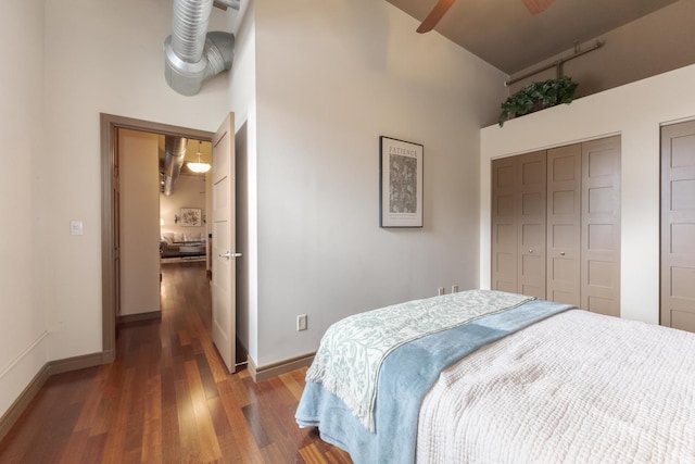212 N Center St Unit 502, Bloomington, IL 61701 - bedroom featuring high vaulted ceiling, wood finished floors, baseboards, and a ceiling fan