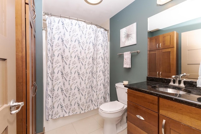 212 N Center St Unit 502, Bloomington, IL 61701 - bathroom with tile patterned flooring, vanity, toilet, and a shower with shower curtain