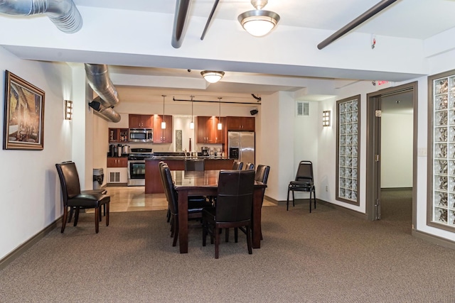 212 N Center St Unit 502, Bloomington, IL 61701 - dining area with dark carpet and baseboards
