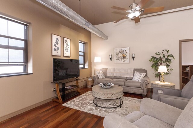212 N Center St Unit 502, Bloomington, IL 61701 - living room with ceiling fan, dark wood-style flooring, baseboards, and high vaulted ceiling
