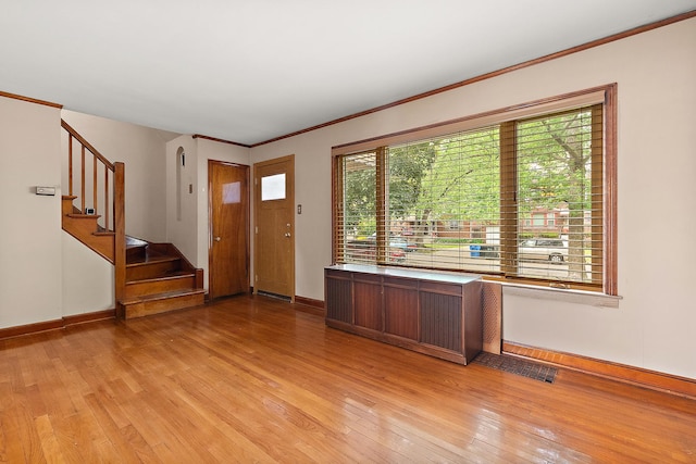 10341 S Trumbull Ave, Chicago, IL 60655 - foyer with light wood finished floors, baseboards, stairway, and ornamental molding