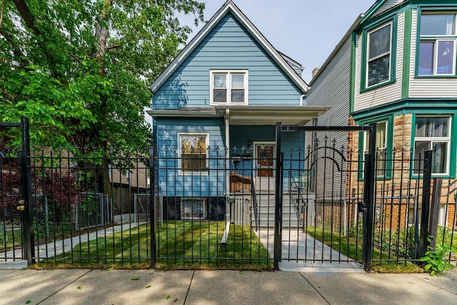1826 N Keeler Ave, Chicago, IL 60639 - view of front of home featuring a fenced front yard, a gate, and a porch