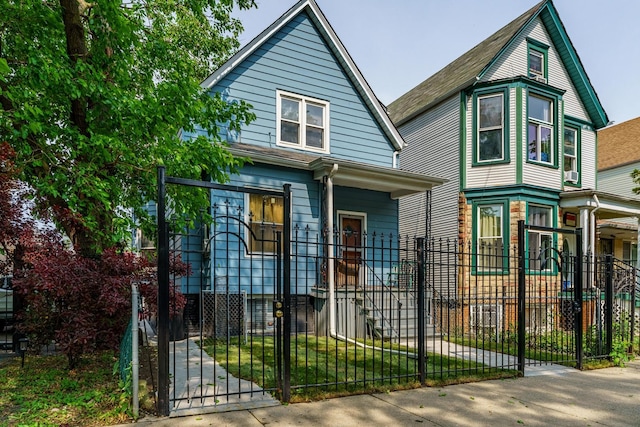 1826 N Keeler Ave, Chicago, IL 60639 - view of front of house with a fenced front yard and a gate