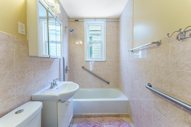1826 N Keeler Ave, Chicago, IL 60639 - full bath with tile walls, vanity, toilet, and shower / washtub combination