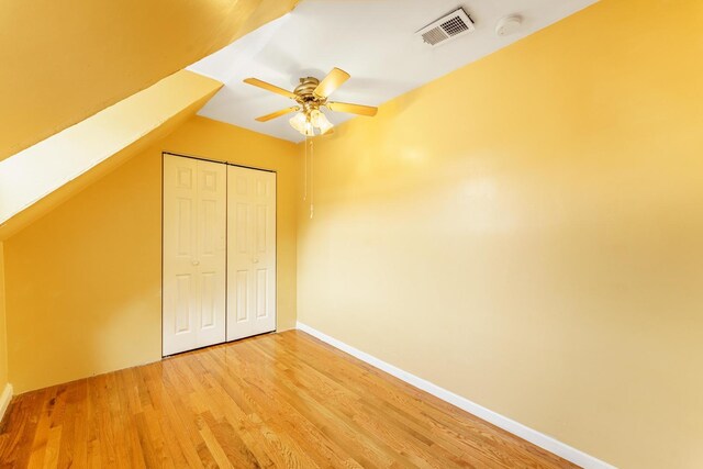1826 N Keeler Ave, Chicago, IL 60639 - unfurnished bedroom featuring light wood-style flooring, a closet, baseboards, and ceiling fan
