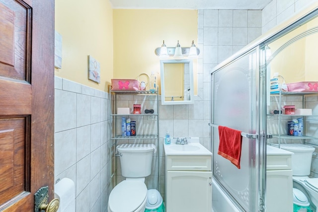 1826 N Keeler Ave, Chicago, IL 60639 - full bathroom featuring tile walls, toilet, vanity, and a shower with door