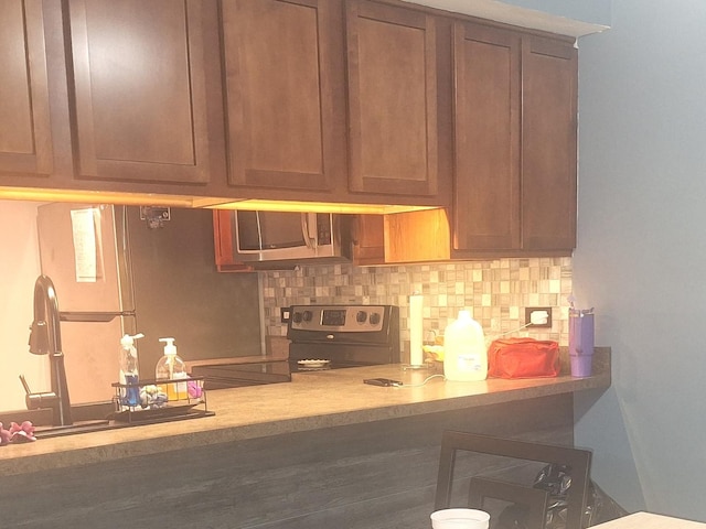840 Elder Rd Unit A305, Homewood, IL 60430 - bar area with appliances with stainless steel finishes, decorative backsplash, and a sink