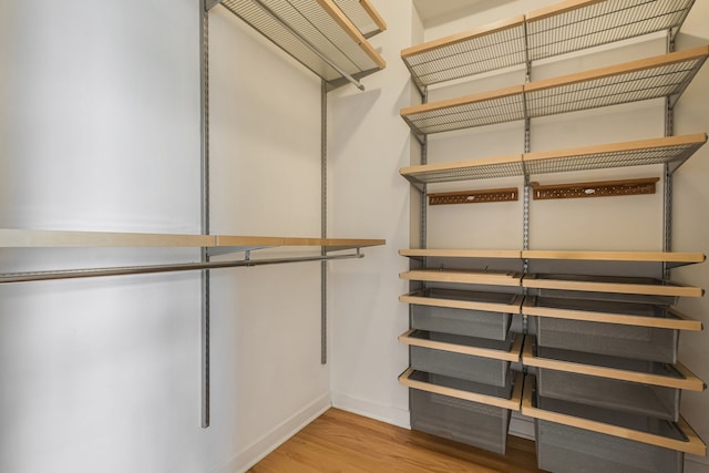 828 N California Ave Unit 3, Chicago, IL 60622 - walk in closet with wood finished floors