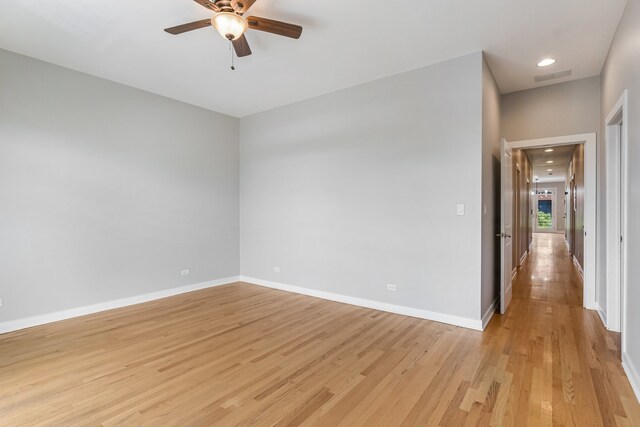 828 N California Ave Unit 3, Chicago, IL 60622 - unfurnished room featuring light wood-style floors, a ceiling fan, and baseboards