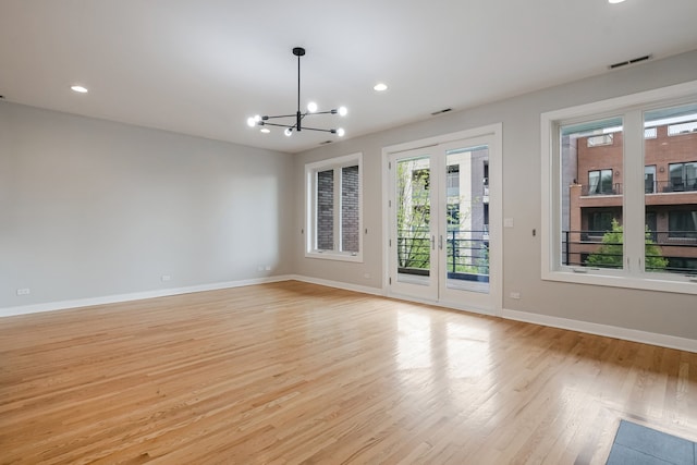 828 N California Ave Unit 3, Chicago, IL 60622 - empty room with plenty of natural light, light wood-style floors, baseboards, and recessed lighting