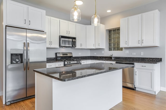 828 N California Ave Unit 3, Chicago, IL 60622 - kitchen with stainless steel appliances, white cabinets, light wood-type flooring, and recessed lighting