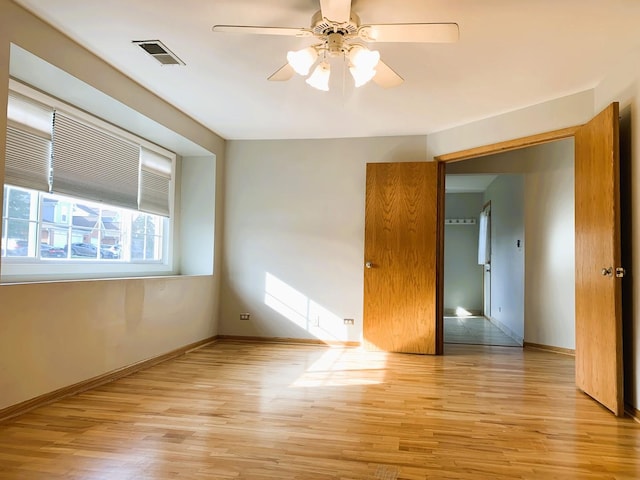 308 Ashbury Ct Unit 1515-1, Roselle, IL 60172 - empty room featuring light wood-style flooring and a ceiling fan