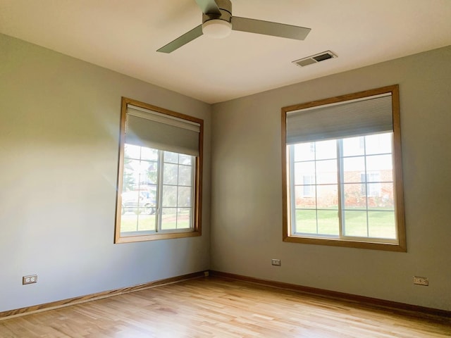 308 Ashbury Ct Unit 1515-1, Roselle, IL 60172 - unfurnished room with plenty of natural light, ceiling fan, and light wood-type flooring