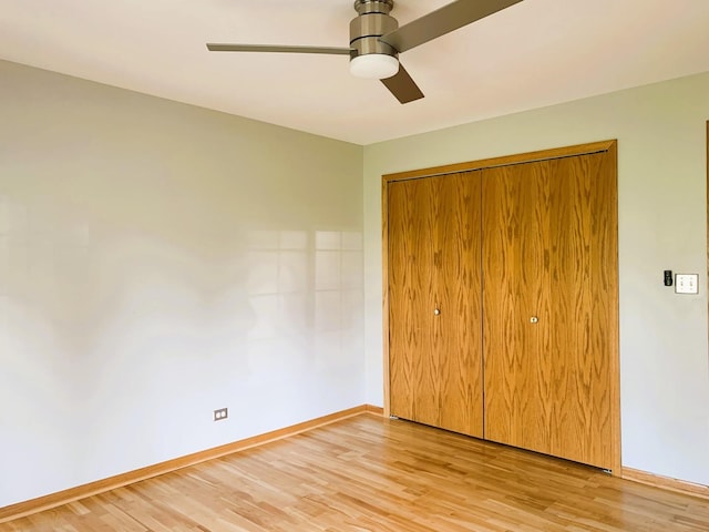 308 Ashbury Ct Unit 1515-1, Roselle, IL 60172 - unfurnished bedroom featuring light wood finished floors, a closet, and a ceiling fan