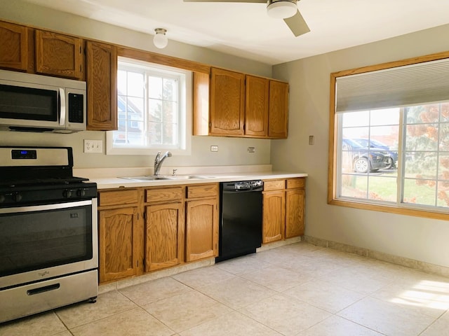 308 Ashbury Ct Unit 1515-1, Roselle, IL 60172 - kitchen with appliances with stainless steel finishes, healthy amount of natural light, light countertops, and a ceiling fan