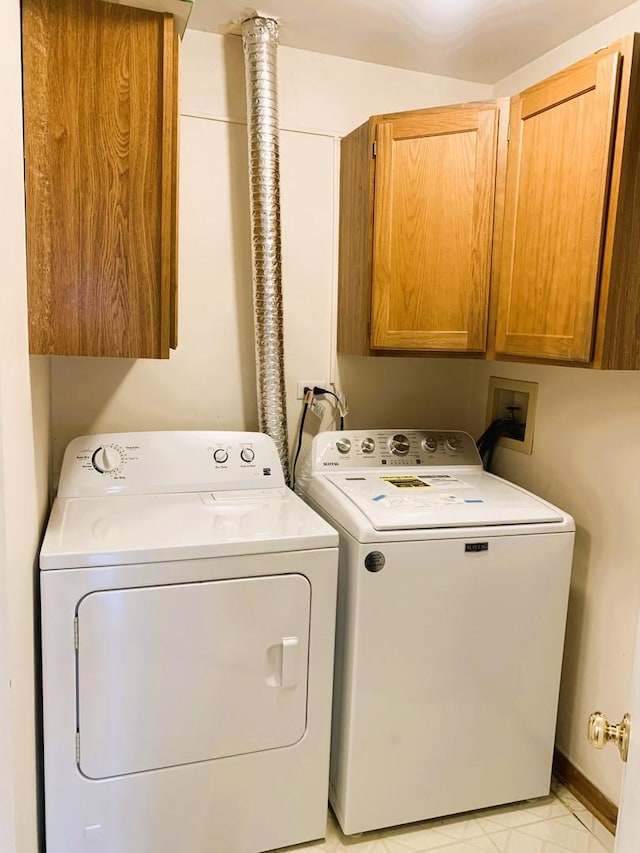 308 Ashbury Ct Unit 1515-1, Roselle, IL 60172 - laundry area with cabinet space and washer and clothes dryer