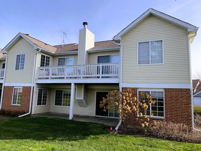 308 Ashbury Ct Unit 1515-1, Roselle, IL 60172 - back of property featuring a lawn, a chimney, brick siding, and a patio