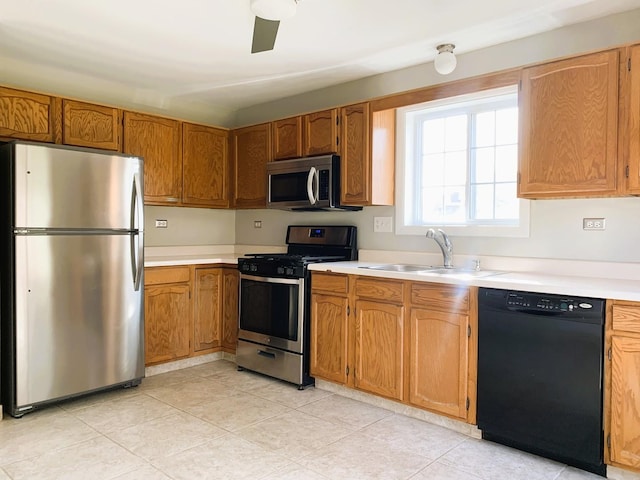 308 Ashbury Ct Unit 1515-1, Roselle, IL 60172 - kitchen featuring appliances with stainless steel finishes, light countertops, brown cabinetry, and light tile patterned flooring
