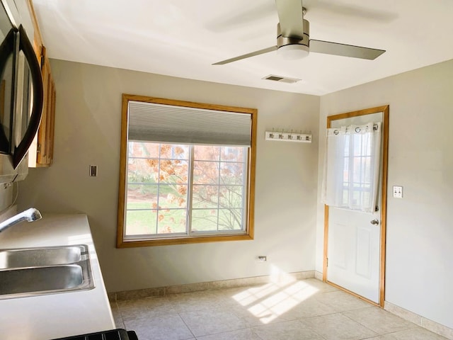308 Ashbury Ct Unit 1515-1, Roselle, IL 60172 - laundry area featuring ceiling fan and light tile patterned floors