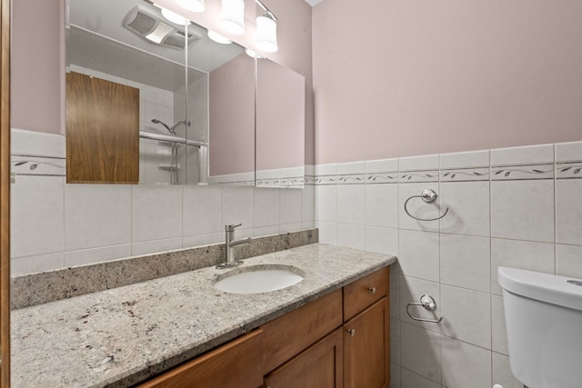 132 Pratt Blvd, Roselle, IL 60172 - full bathroom featuring vanity, toilet, a shower with door, and tile walls