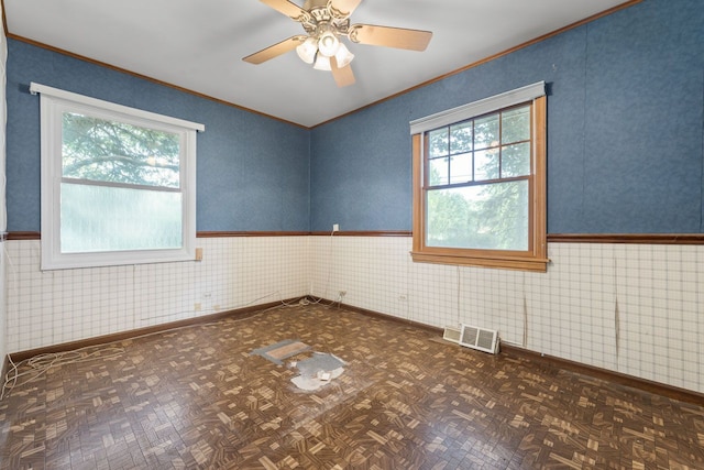132 Pratt Blvd, Roselle, IL 60172 - spare room featuring crown molding, wainscoting, baseboards, and a ceiling fan