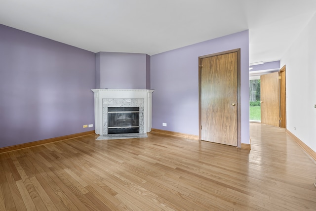 132 Pratt Blvd, Roselle, IL 60172 - unfurnished living room featuring light wood-style floors, a fireplace, and baseboards