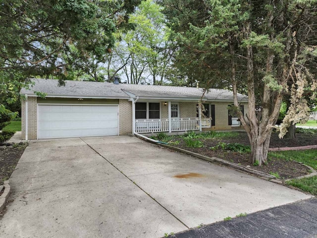 132 Pratt Blvd, Roselle, IL 60172 - single story home with covered porch, brick siding, concrete driveway, and an attached garage