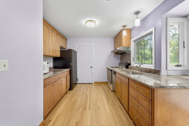 132 Pratt Blvd, Roselle, IL 60172 - kitchen featuring white appliances, a sink, under cabinet range hood, light wood-style floors, and light stone counters